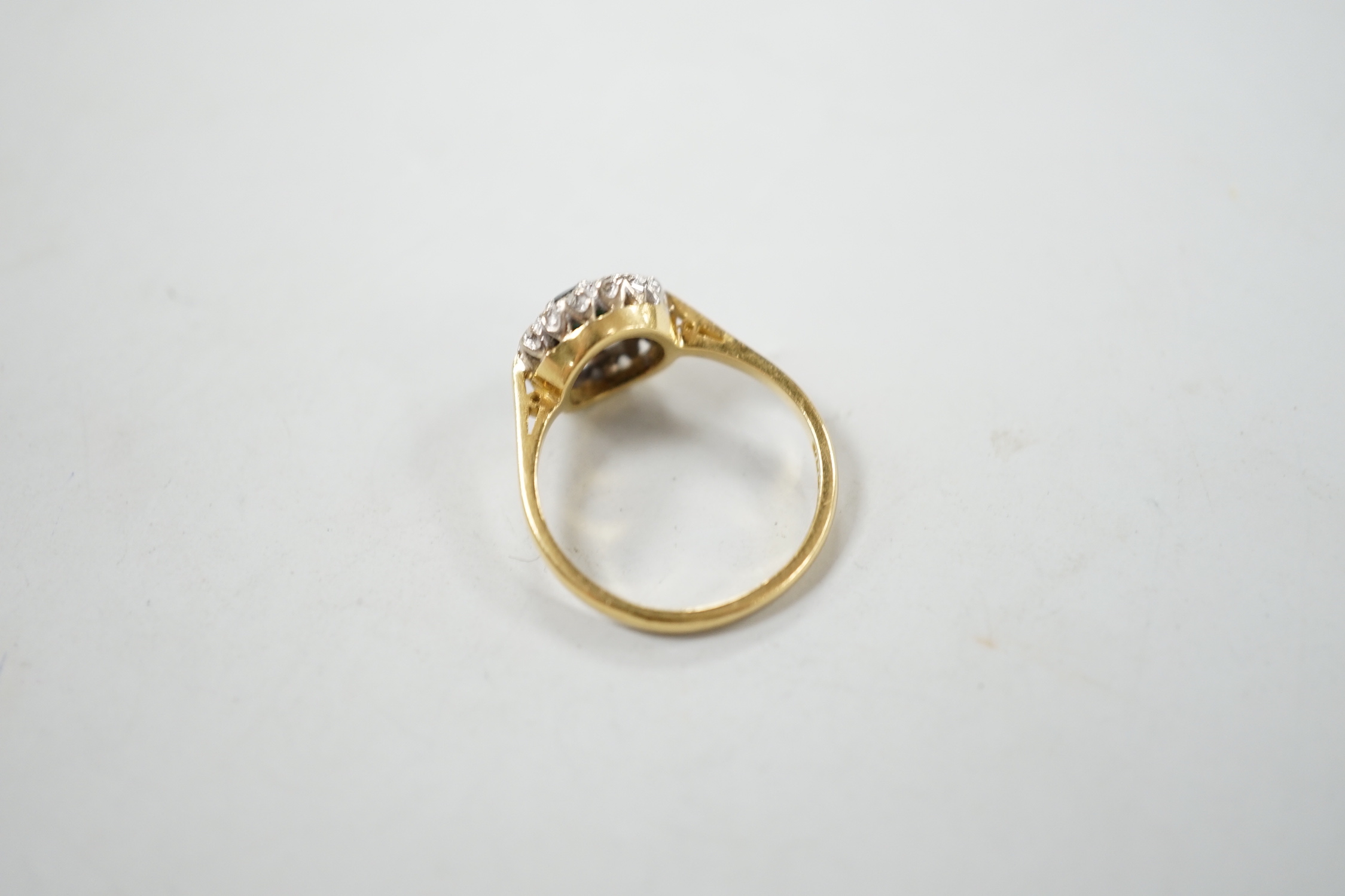 A 1960's 18ct gold, sapphire and diamond set circular cluster ring, size N, gross weight 3.7 grams.